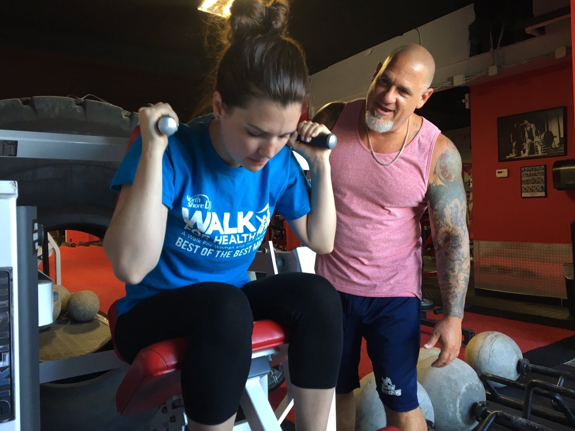 Gym trainer training a lady
