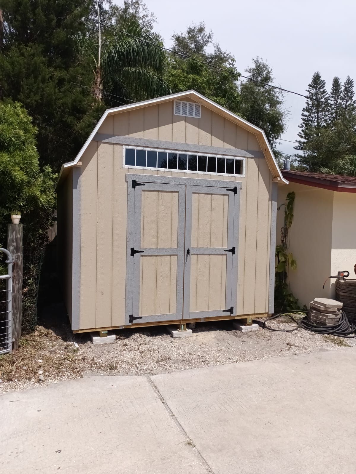 A barn shed with a window on the top of it