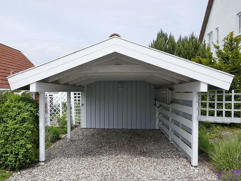 A carport with a white roof
