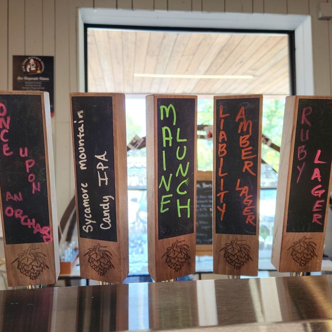 Colorful handmade signs for student birthdays and lunch in a hallway display