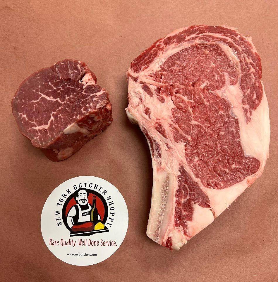 Two raw beef steaks beside a butcher’s logo sticker on brown paper.
