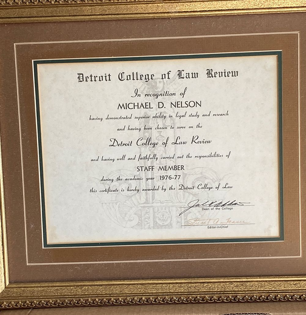 A framed certificate from the Detroit College of Law
