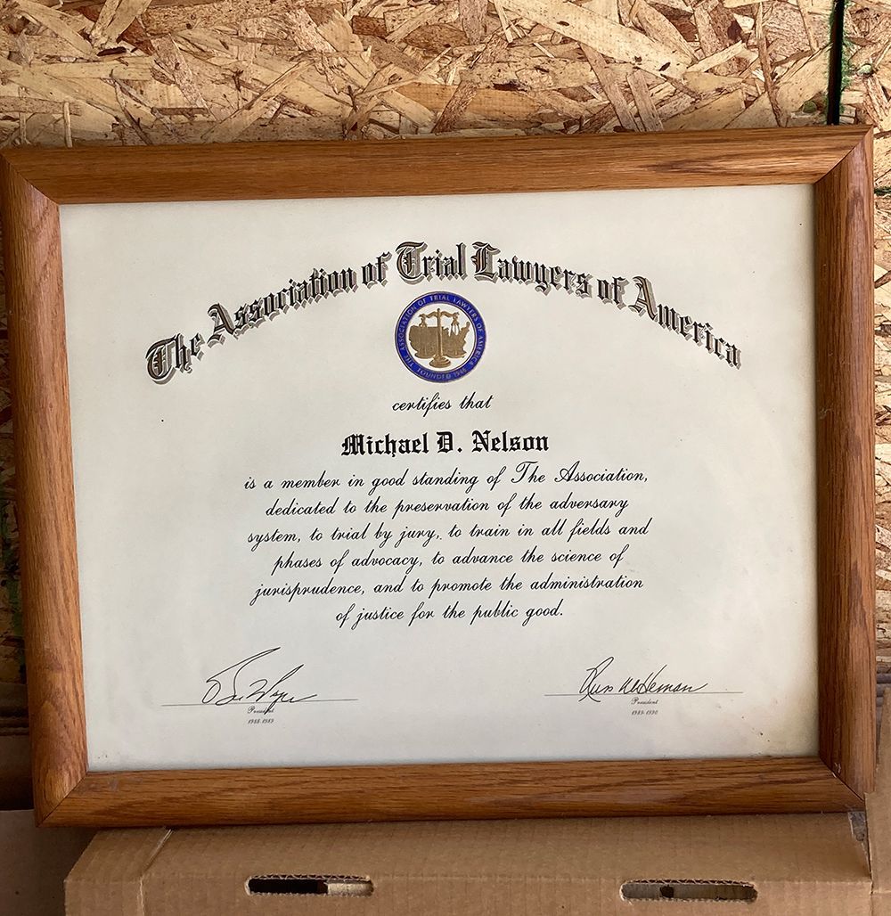A framed certificate from the Association of Trial Judges of America