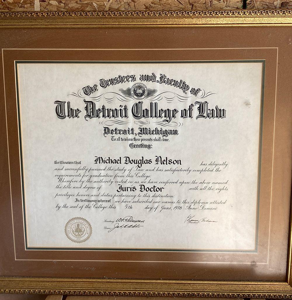 A framed diploma from the Detroit College of Law