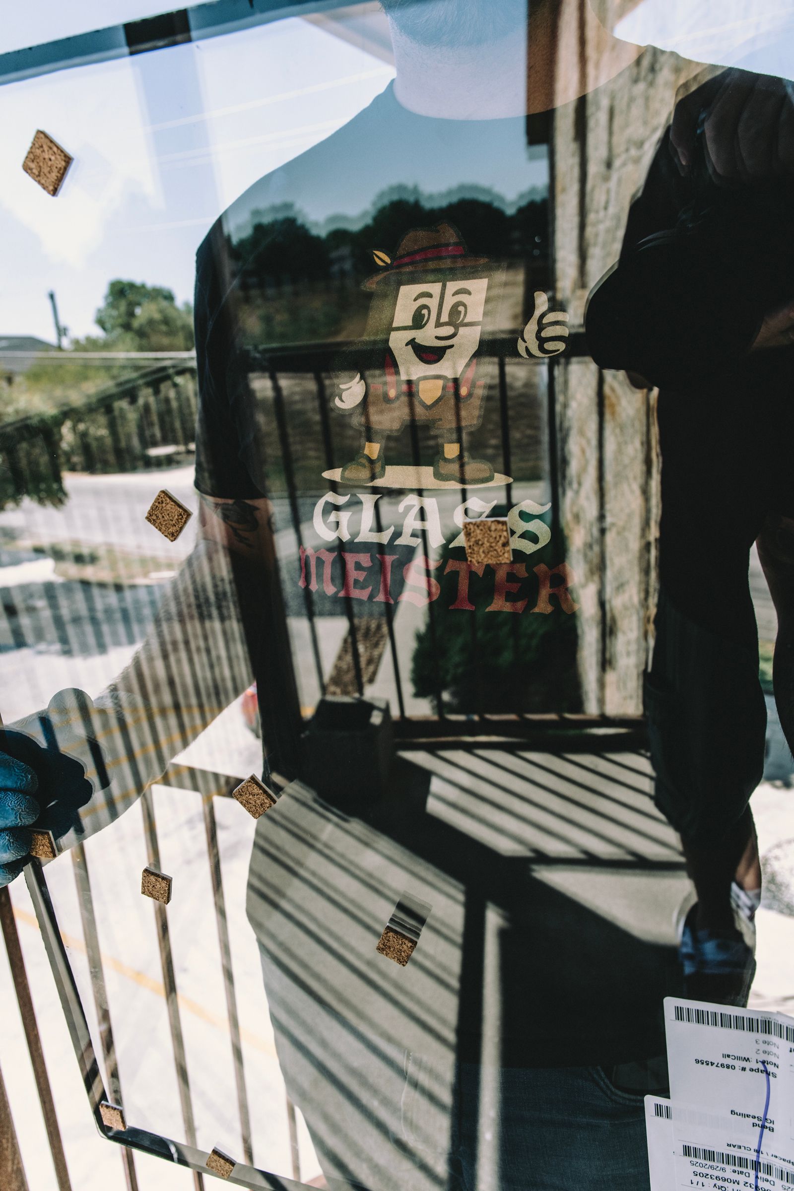 Mannequin in a store window, wearing a t-shirt that says