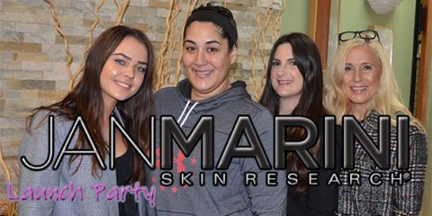 A group of women are standing next to each other in a room.