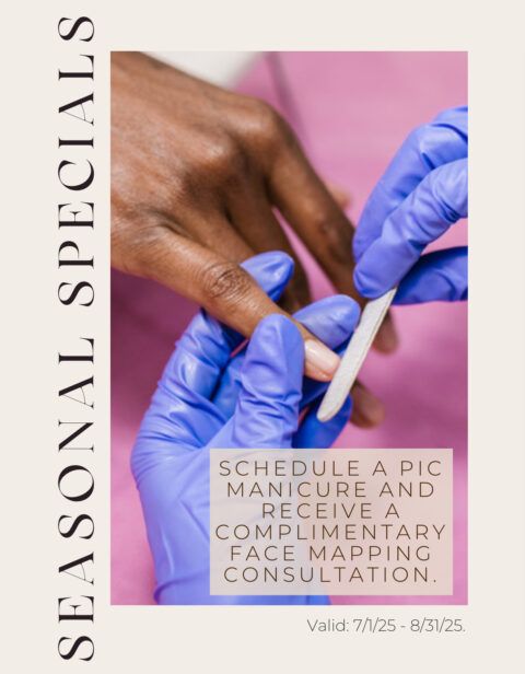 A woman is getting her nails done by a nail technician wearing blue gloves