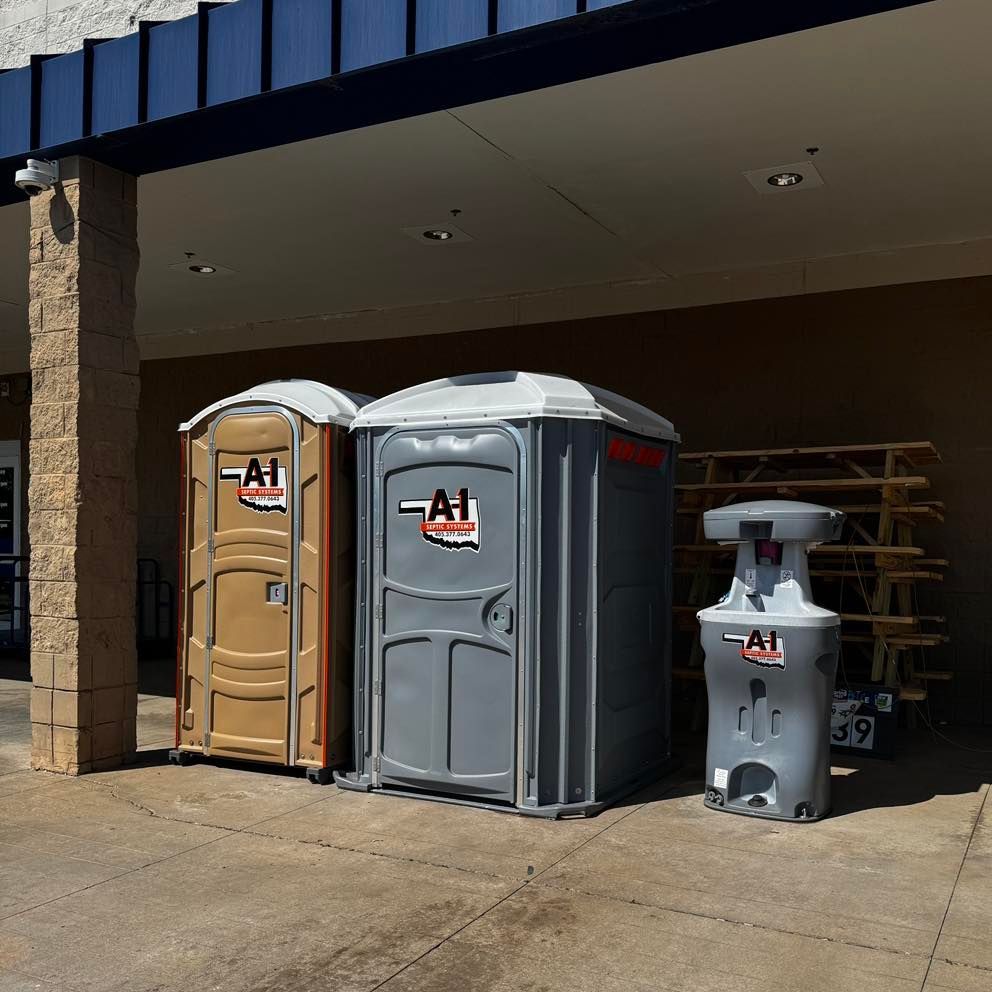 Three portable toilets with a1 written on them