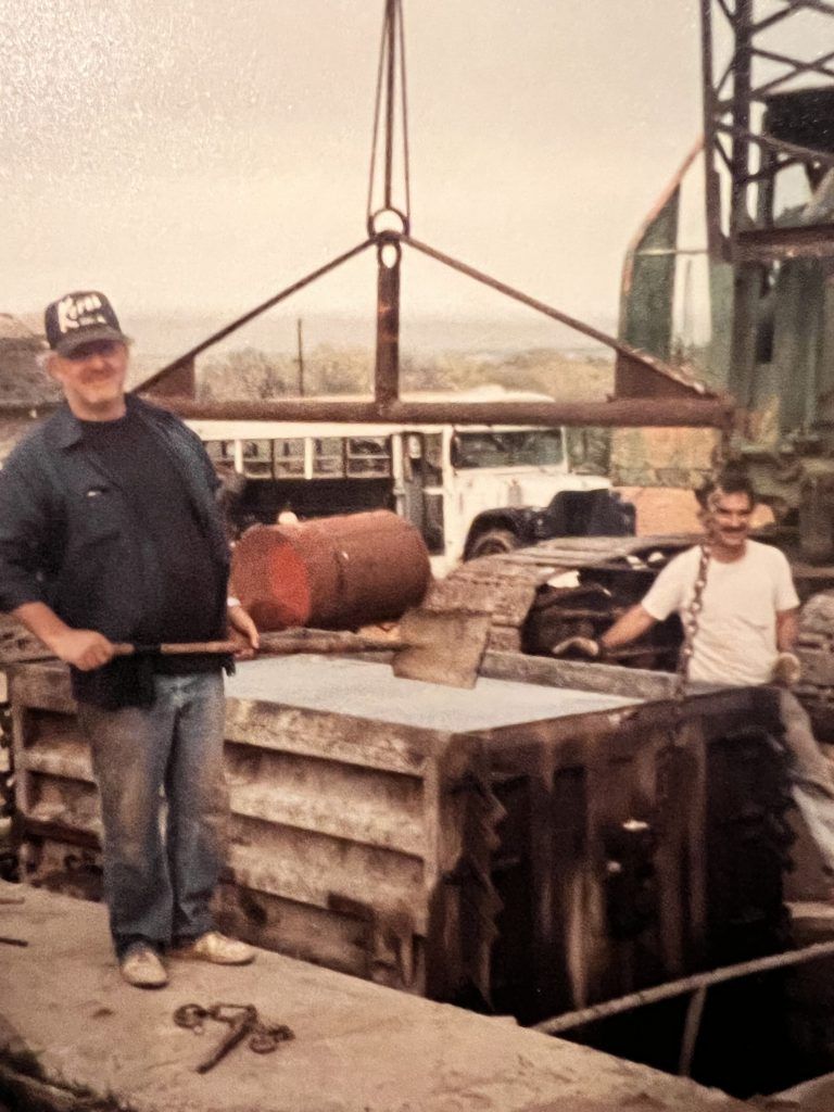 A man wearing a hat with the letter r on it