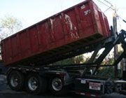 Truck with a roll-off container