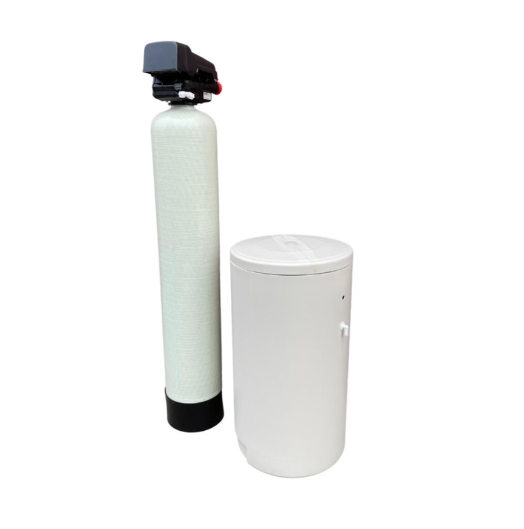 a water softener is sitting next to a bottle on a white background .