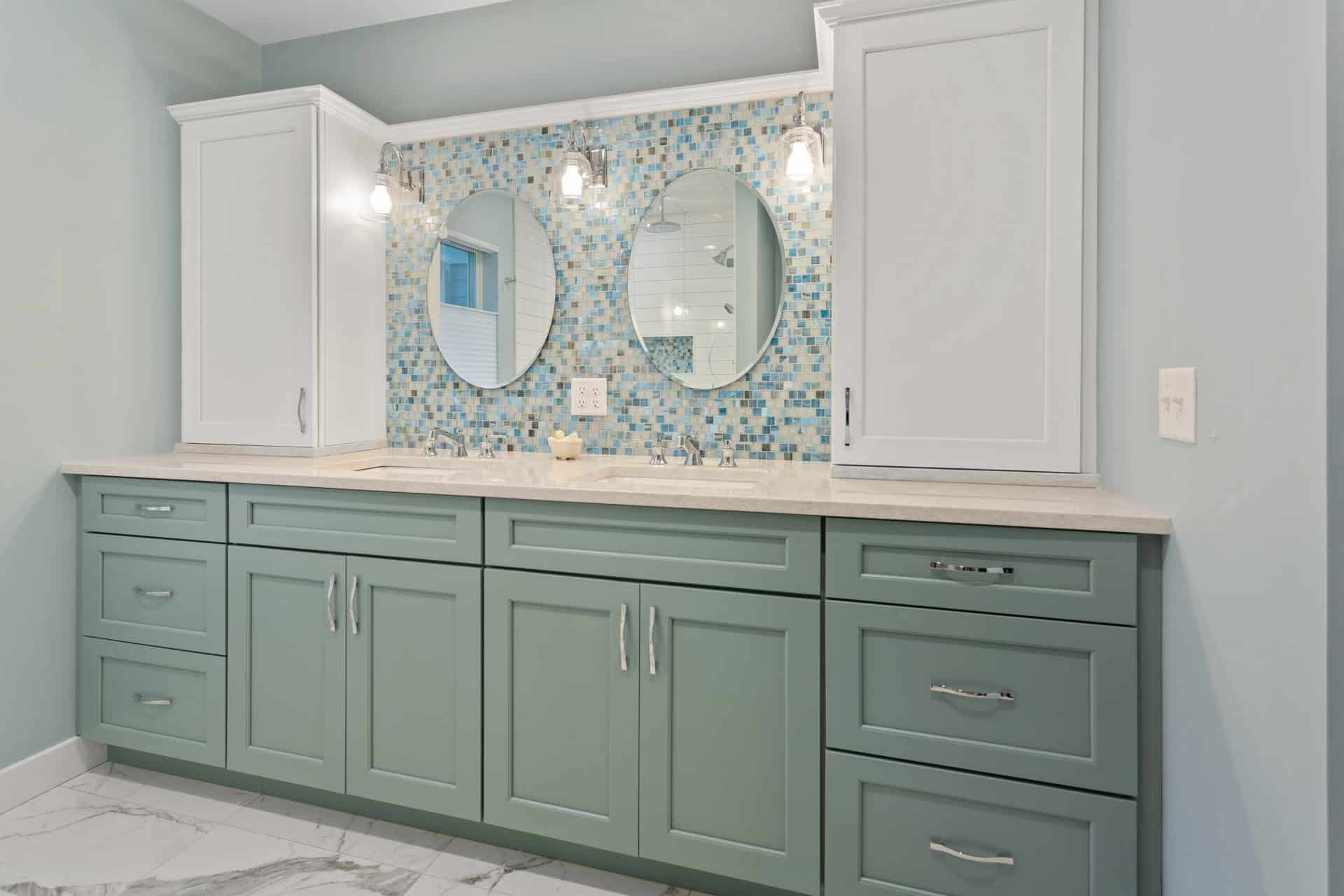 A bathroom with two sinks and two mirrors.