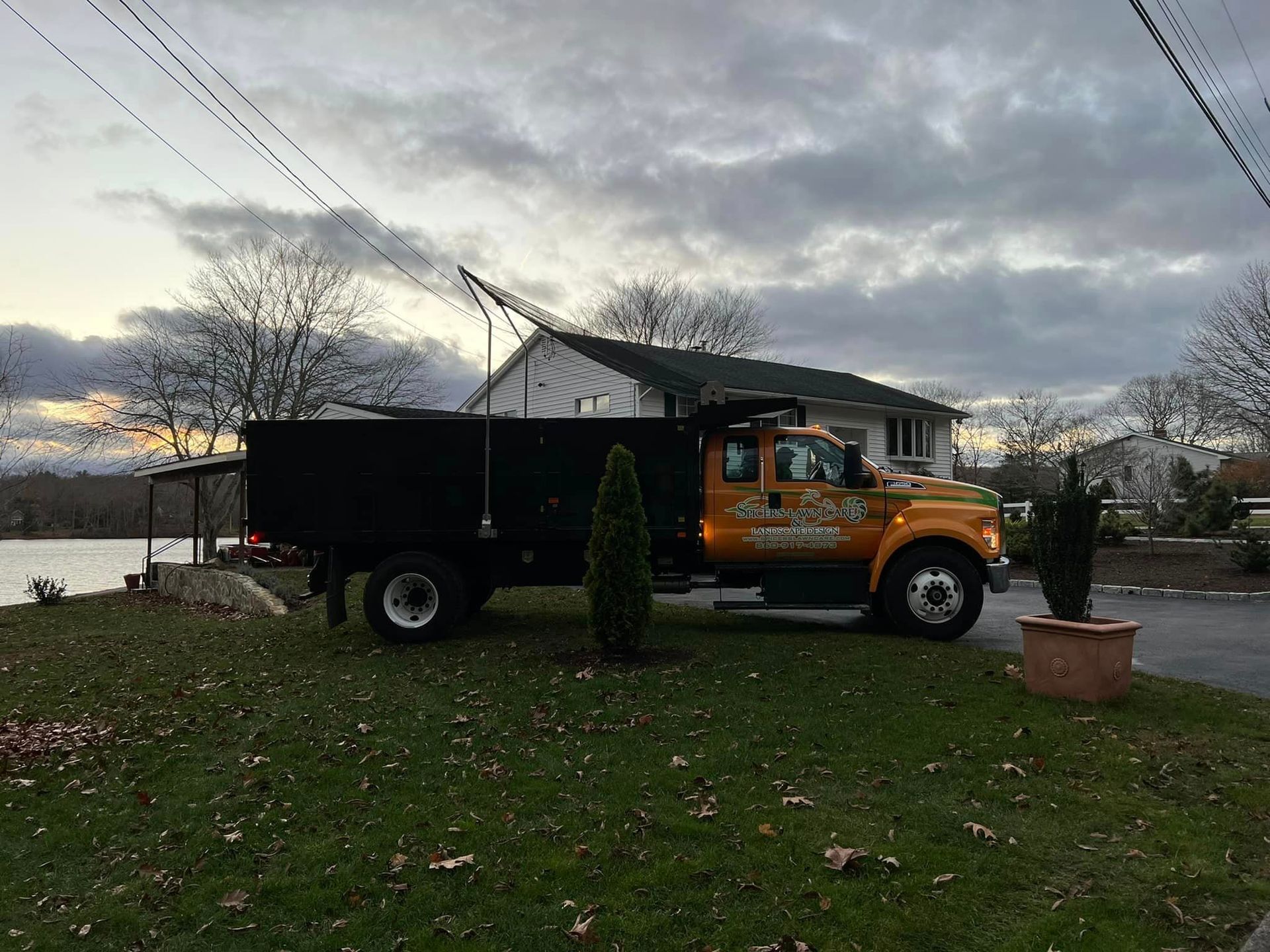 Dump truck parked in front of a house