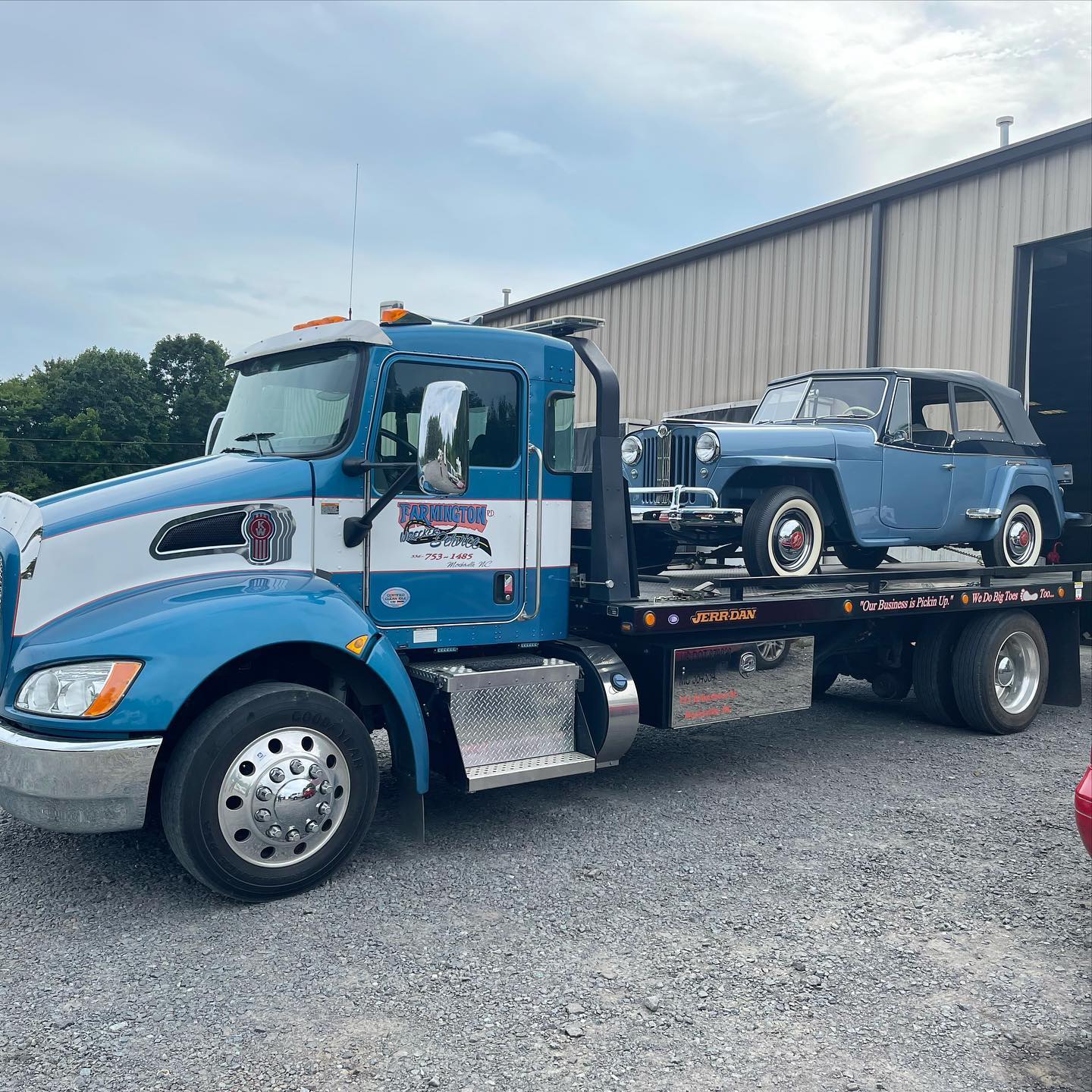 Blue Hauling Old Car