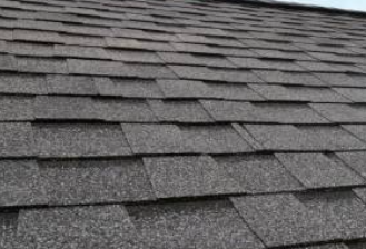 A close up of a roof with shingles on it.