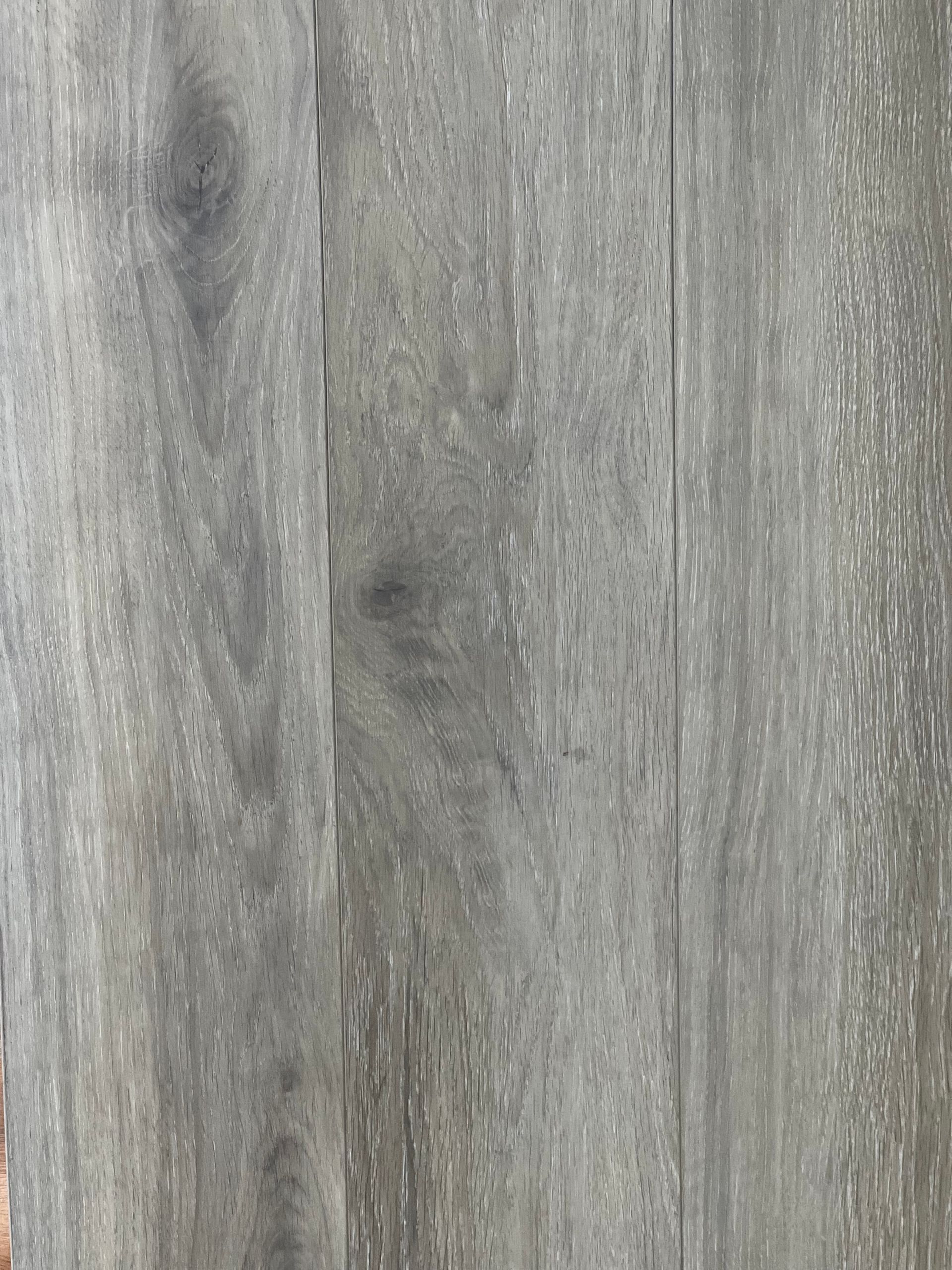 Gray wood grain texture, vertical planks with subtle variation.