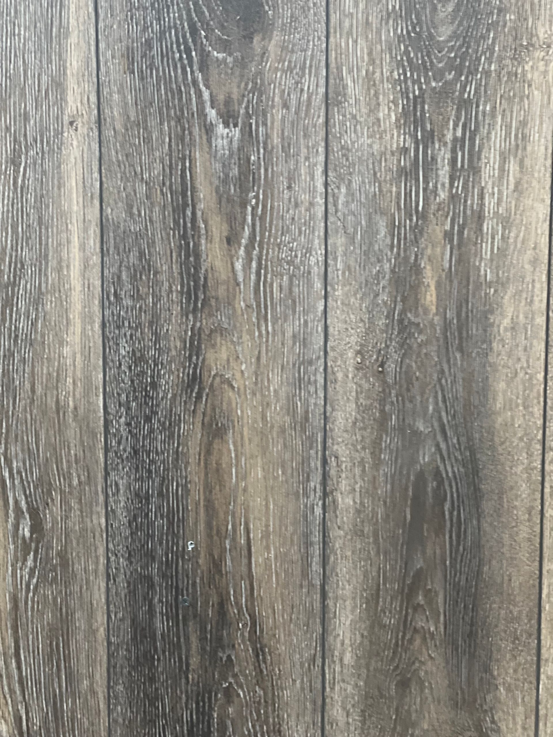 Dark gray wood-grain pattern with vertical planks.