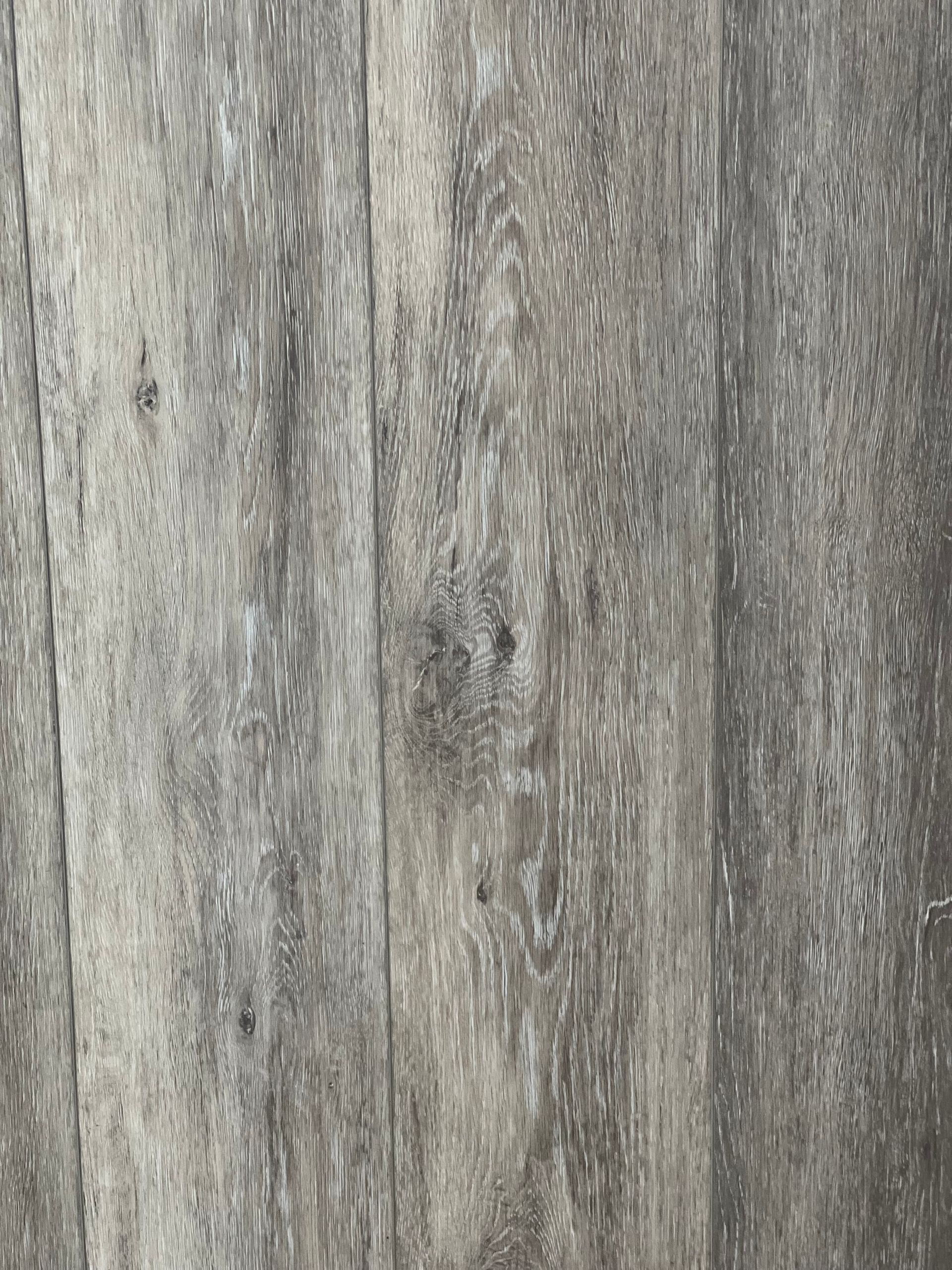 Gray wood grain textured floor.