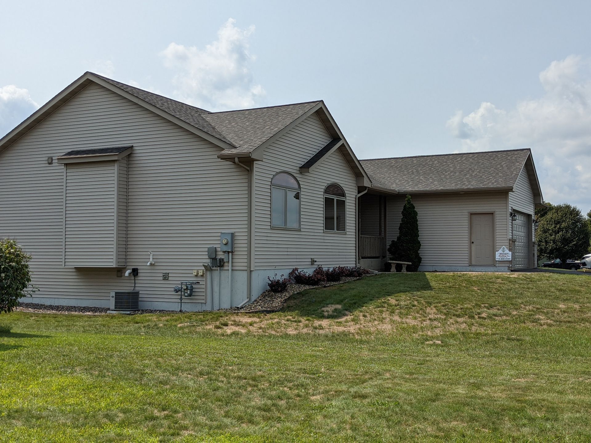 A house with a lot of grass in front of it