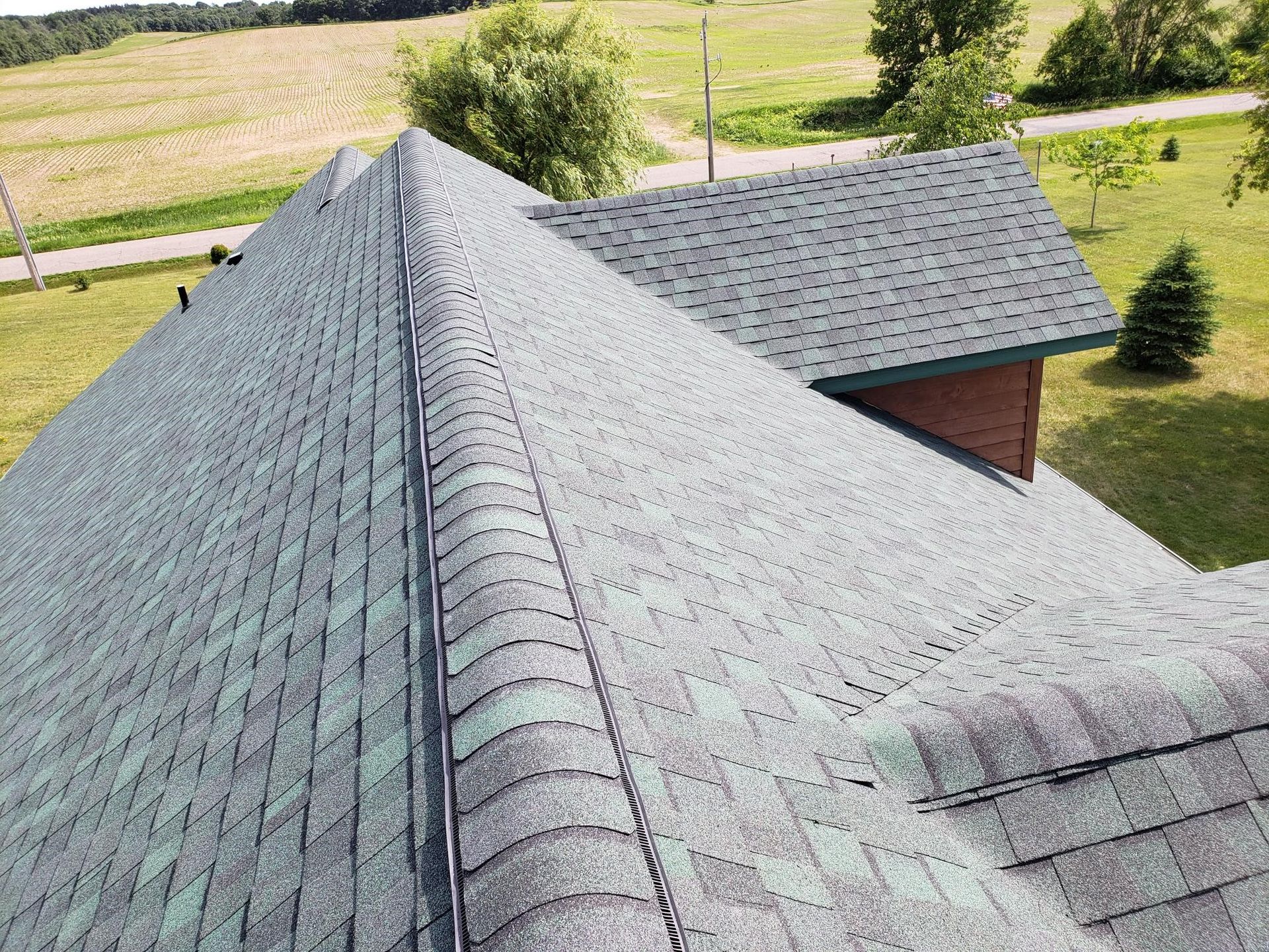 An aerial view of a roof of a house with a lot of shingles.