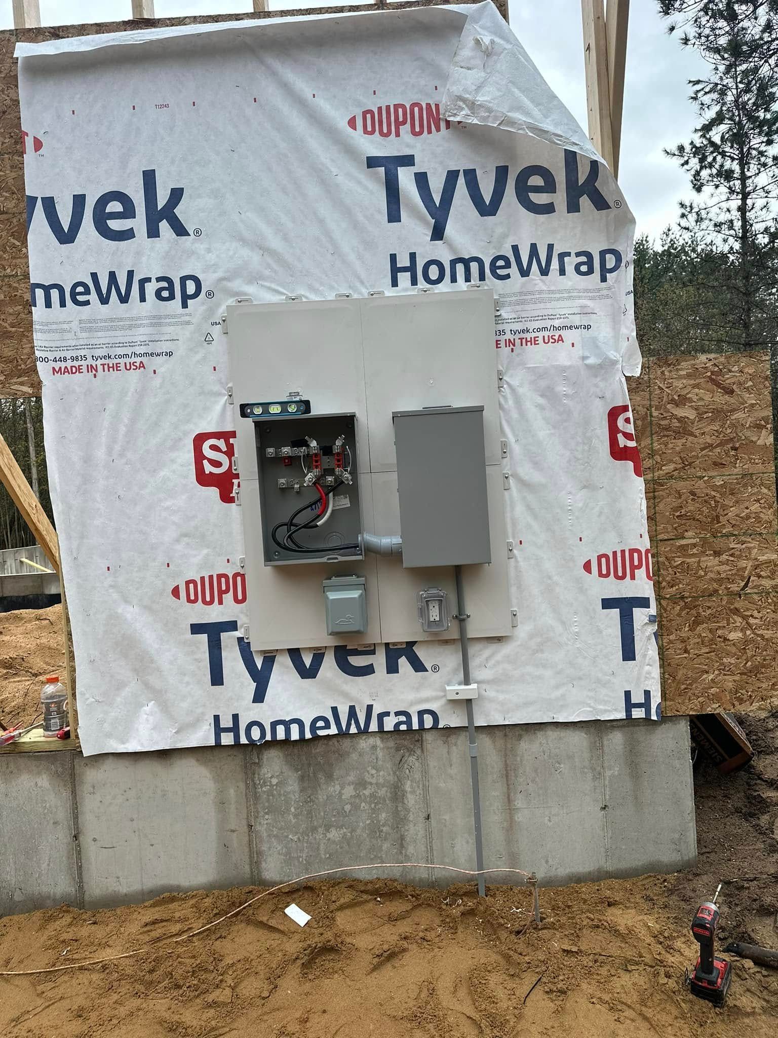 A building under construction with tyvek homewrap on it