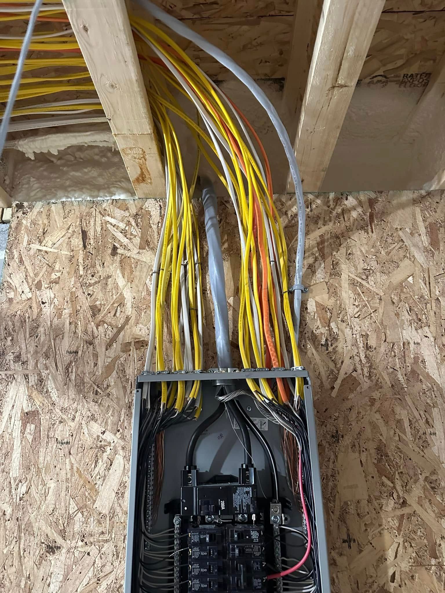 A bunch of wires are coming out of a box.