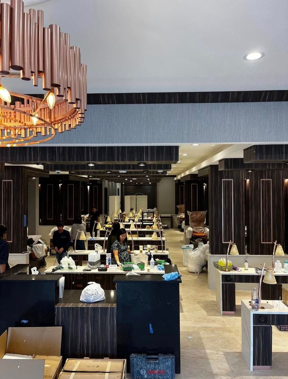 A large room with tables and chairs and a large chandelier