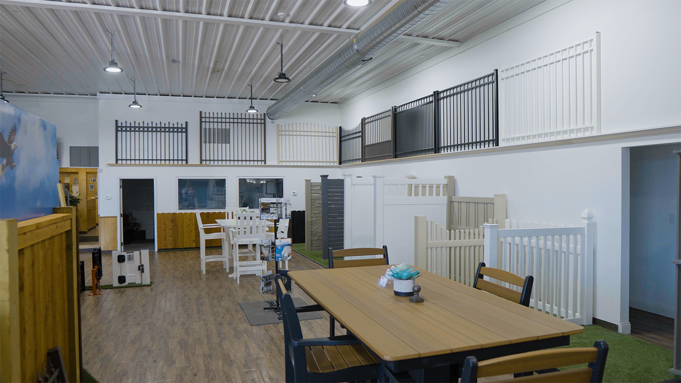 A large room with a table and chairs in it.
