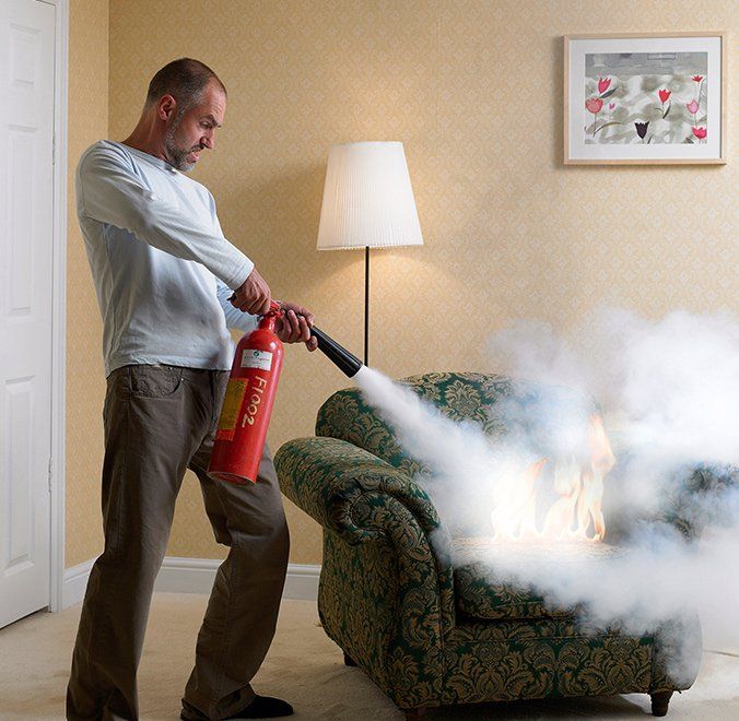 Man using Fire extinguisher