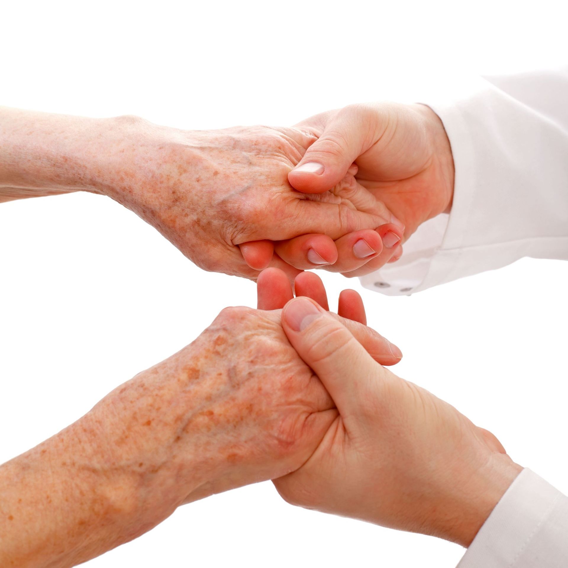 A woman is holding the hand of an older woman