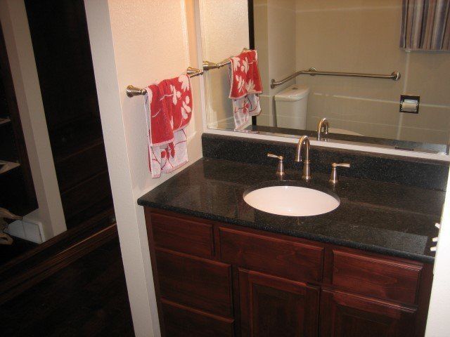 A bathroom with a sink and a mirror