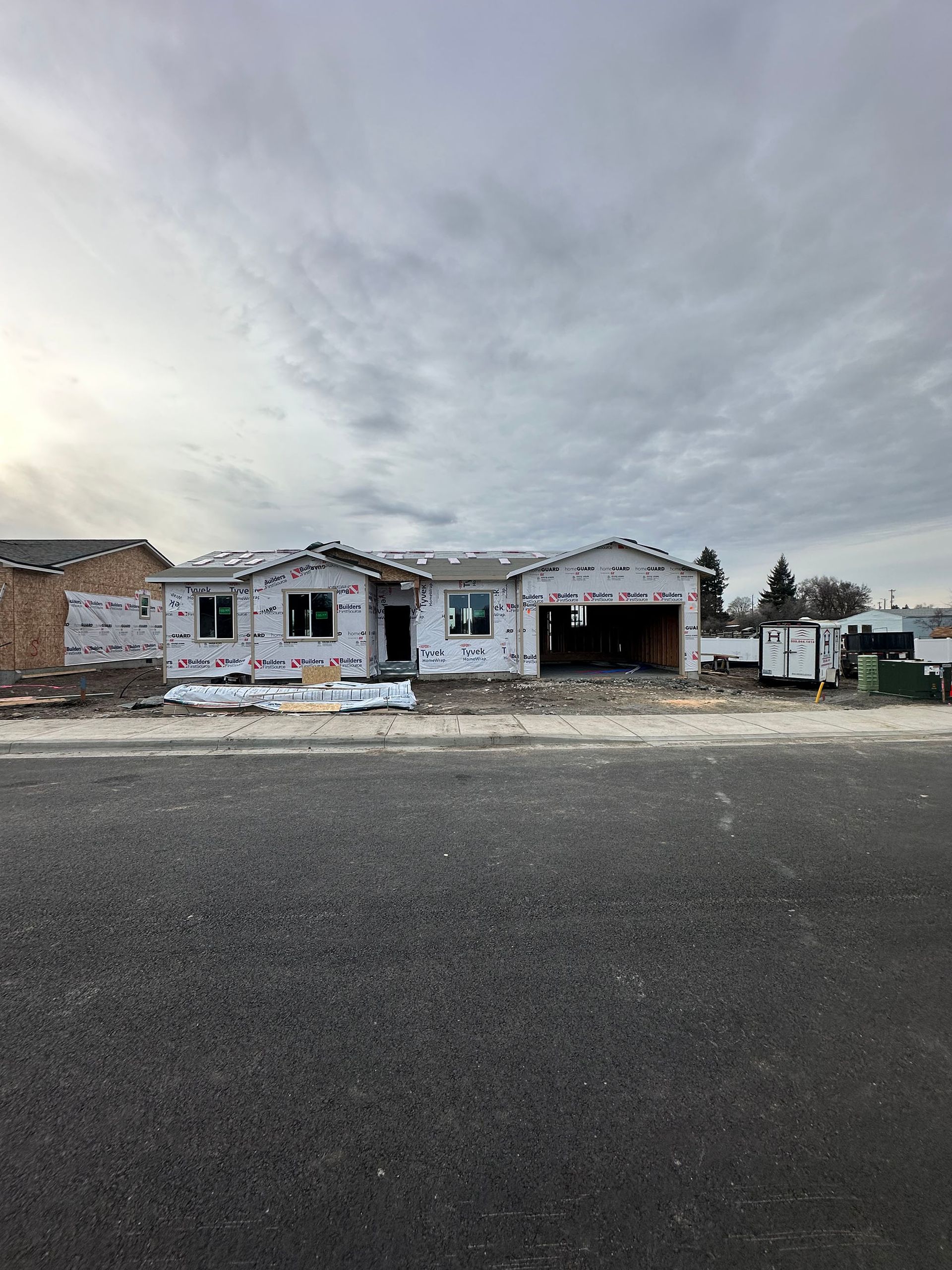A house is being built on the side of the road.