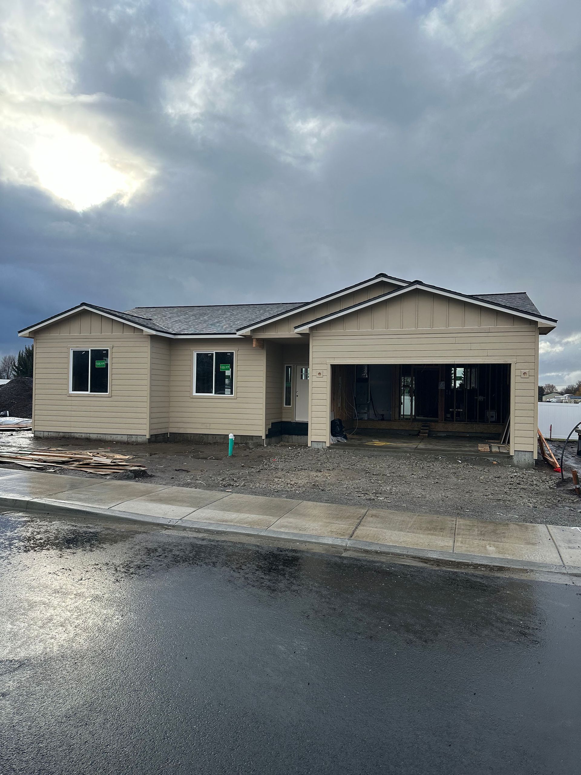 A house is being built on a cloudy day.