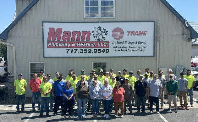 Group of people in front of a building with 