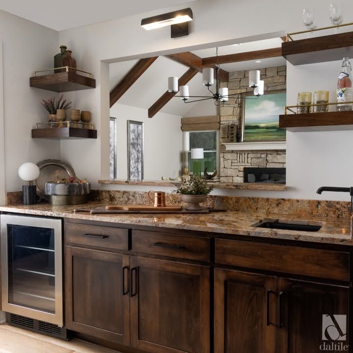 A kitchen with wooden cabinets and granite counter tops