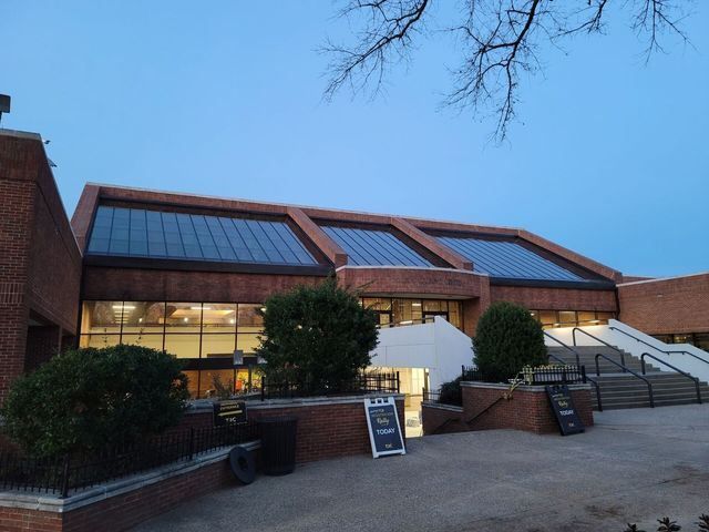A large brick building with stairs leading up to it