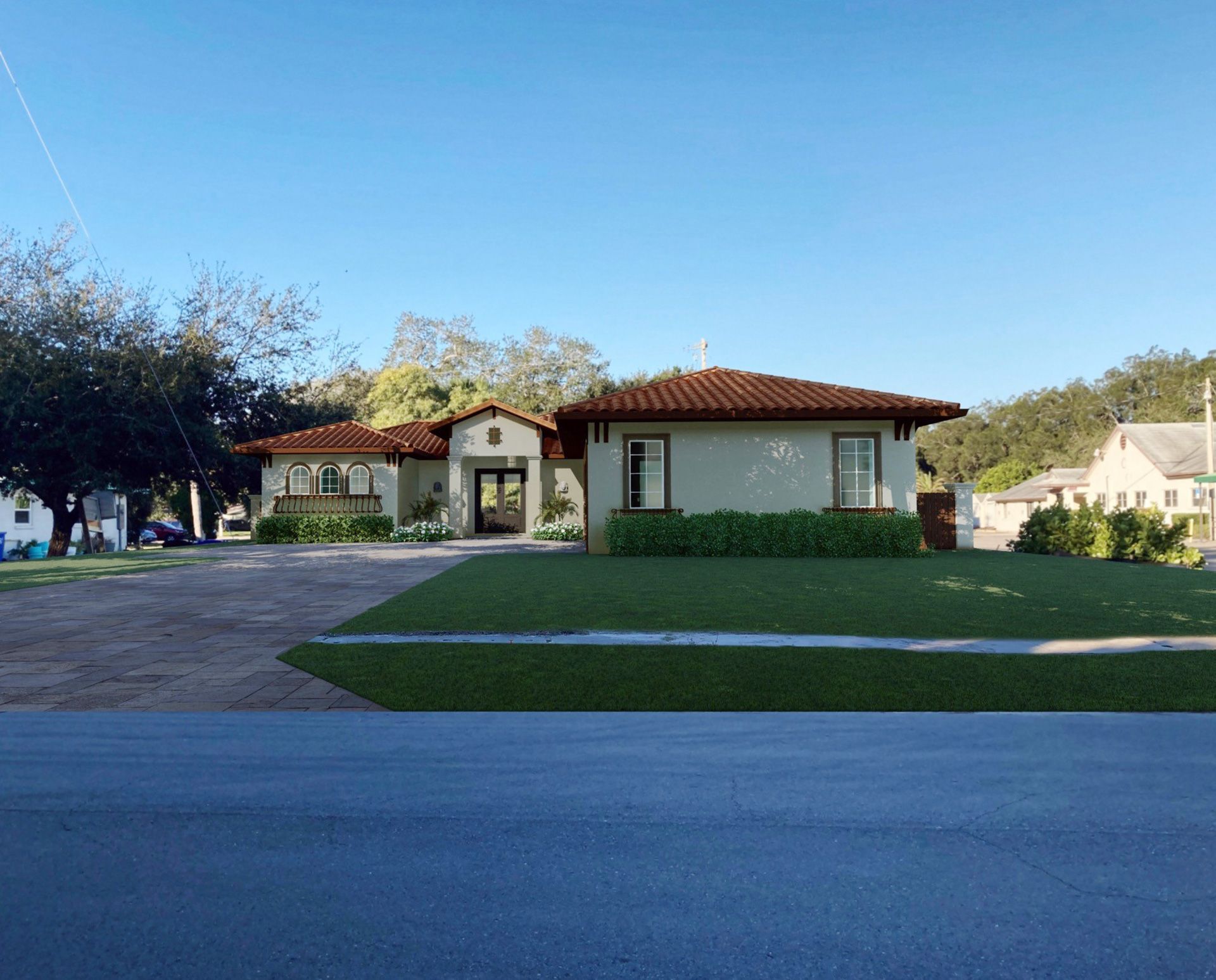 A light green, single-story house with a red tile roof and a well-manicured lawn.