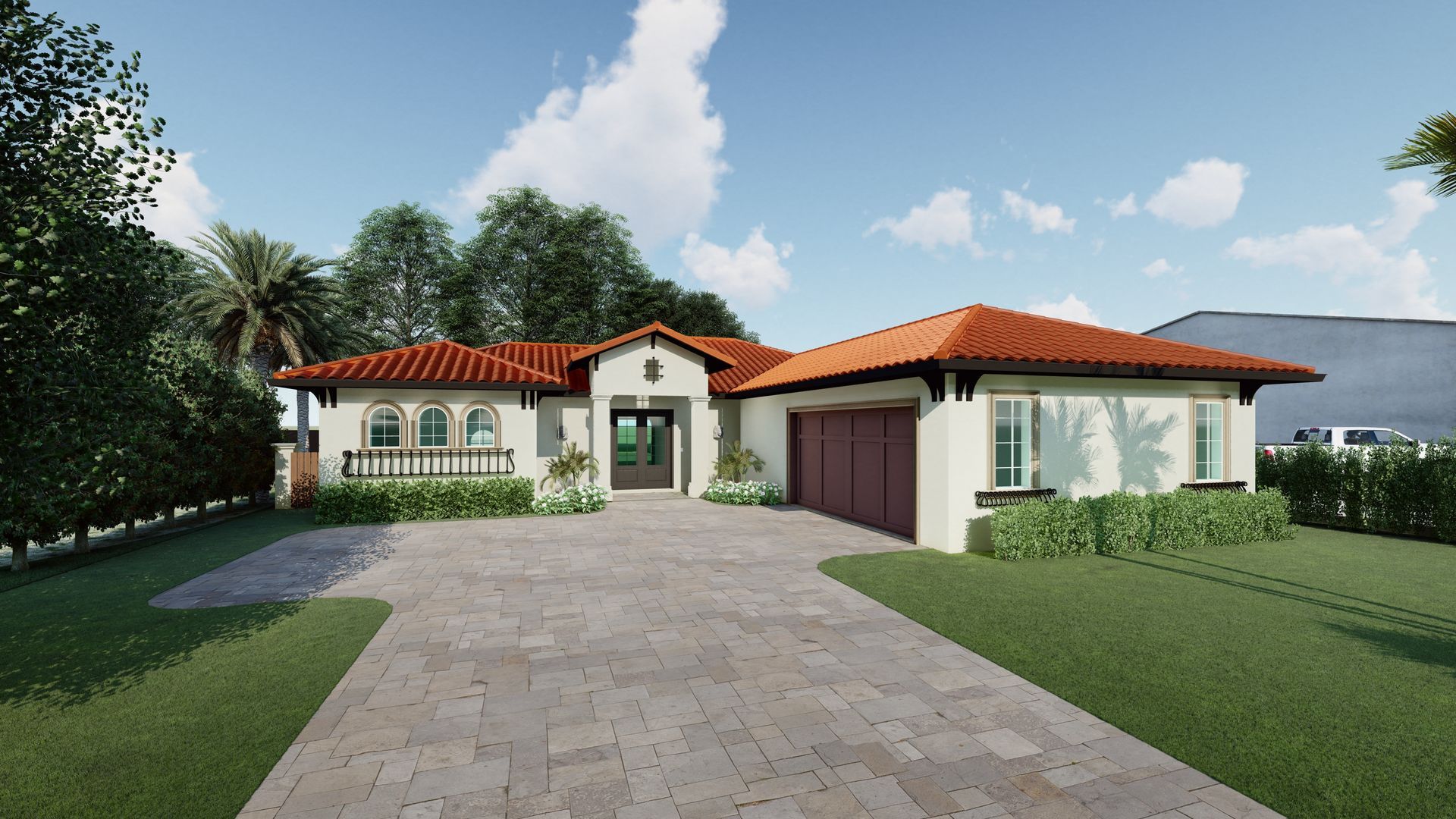 Spanish-style house with orange tile roof and light-colored walls, surrounded by green grass and a paved driveway.