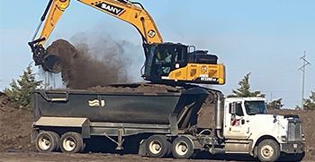 Truck excavating the land