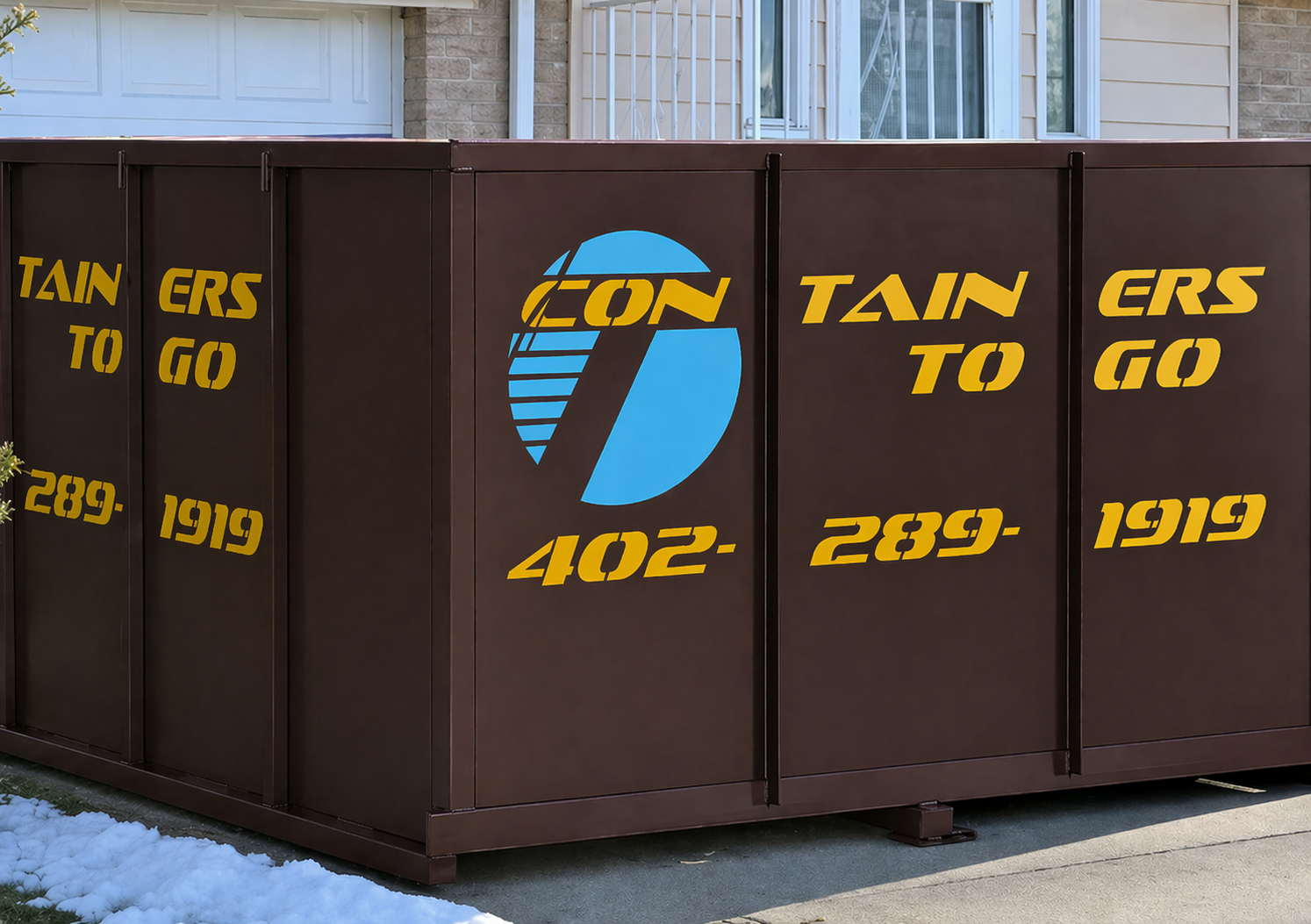 Brown dumpster with teal “Containers To Go” logo and phone number in front of a building in winter.