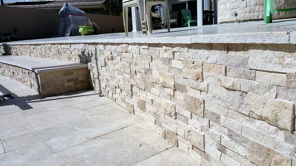 Retaining wall with stone veneer in Lighthouse Point, FL.