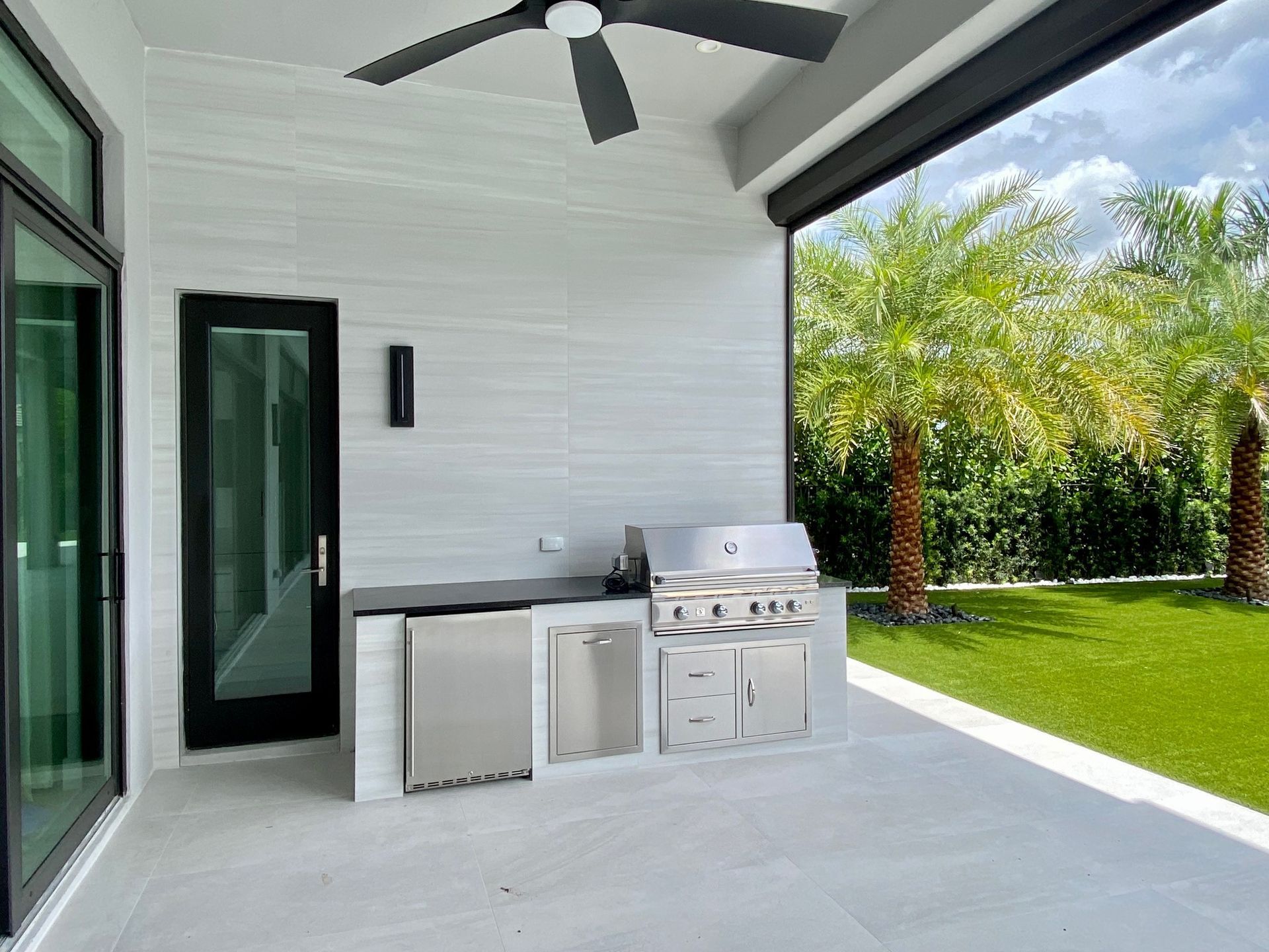 Elegant patio with pergola and dining area in Delray Beach, FL.