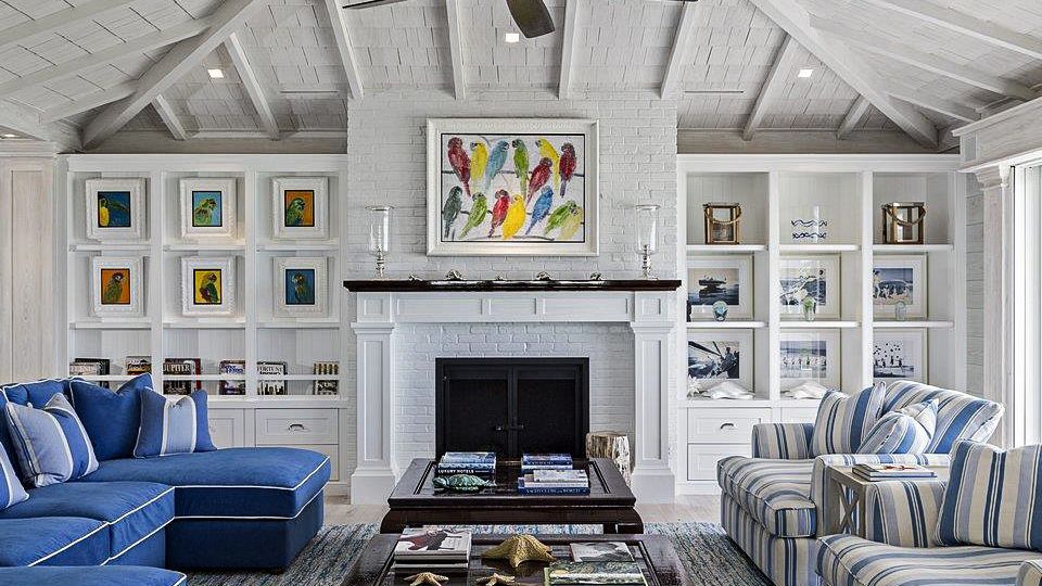A living room filled with furniture and a fireplace.