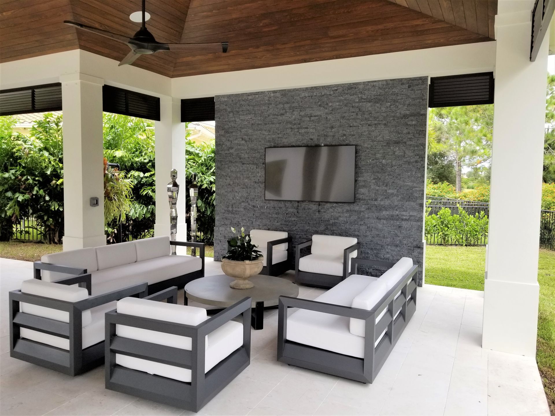 Living room with ceiling fan and comfortable seating in Delray Beach, FL.