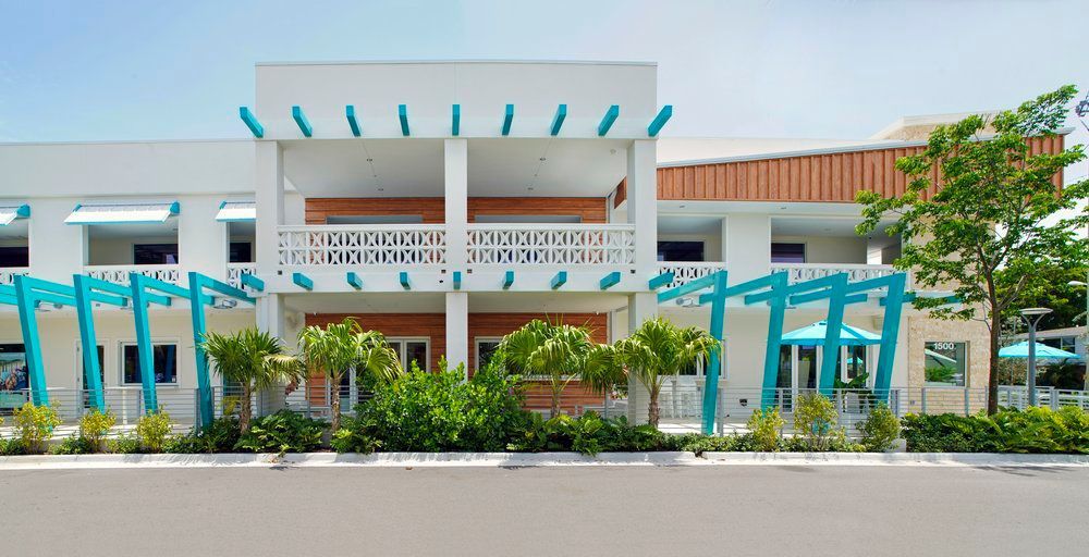 Exterior view of a commercial building with decorative stone and brickwork in Lighthouse Point, FL.