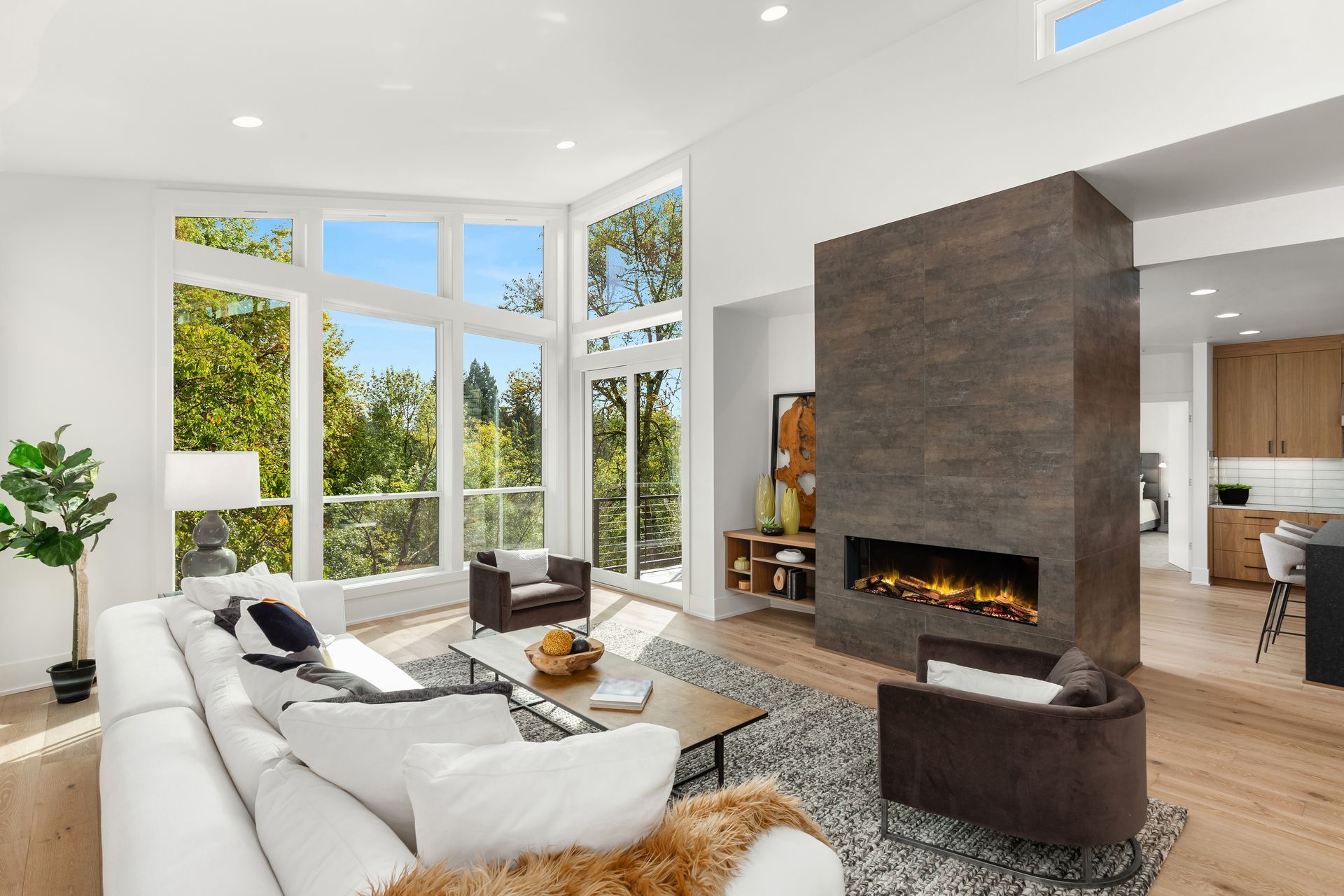 There is a fireplace in the middle of the living room.