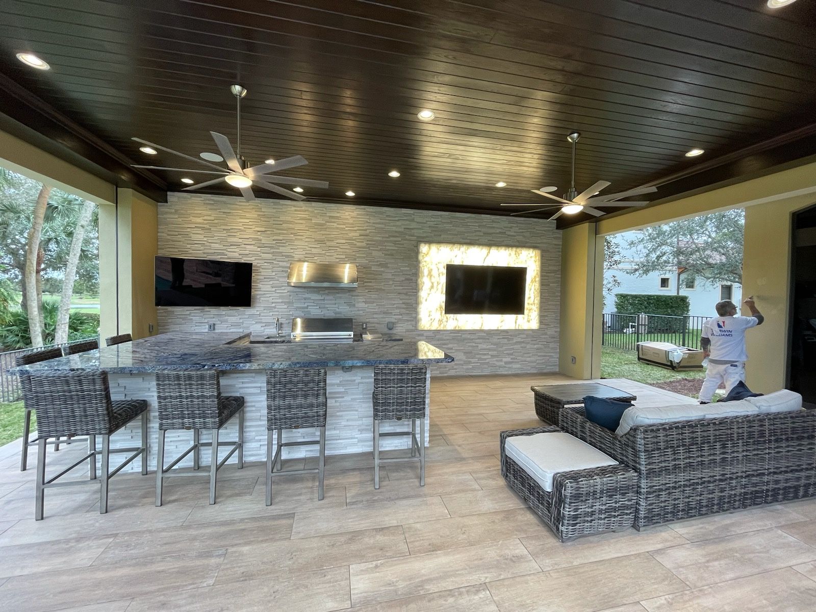 Outdoor grilling station with multiple grills on a wooden deck in Parkland, FL.