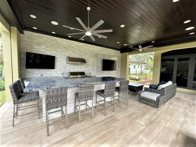 Elegant patio with pergola and dining area in Delray Beach, FL.