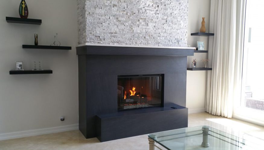 A living room with a fireplace and a coffee table
