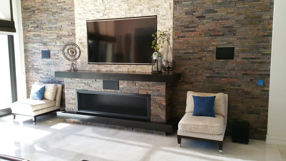 A living room with a fireplace and a flat screen tv